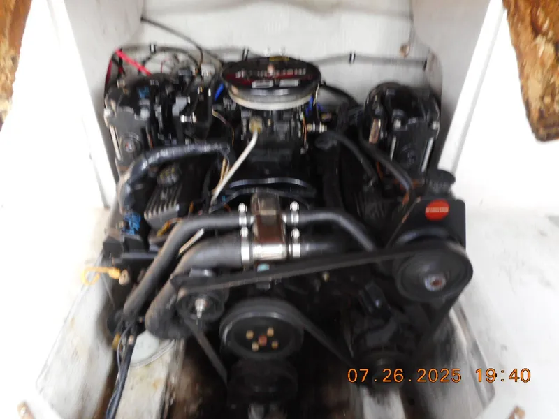 Slide: The Image of 1988 Wellcraft V20 Steplift engine compartment with visible components and wiring. - 6