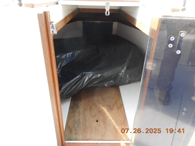 Slide: The Image of Interior cabin of 1988 Wellcraft V20 Steplift boat with wooden and plastic elements. - 7