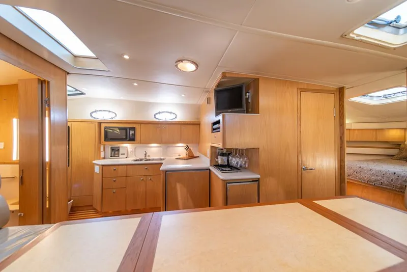 Slide: The Image of Luxurious interior of 2001 Tiara Sport 4000 EXPRESS yacht with modern kitchen amenities. - 11