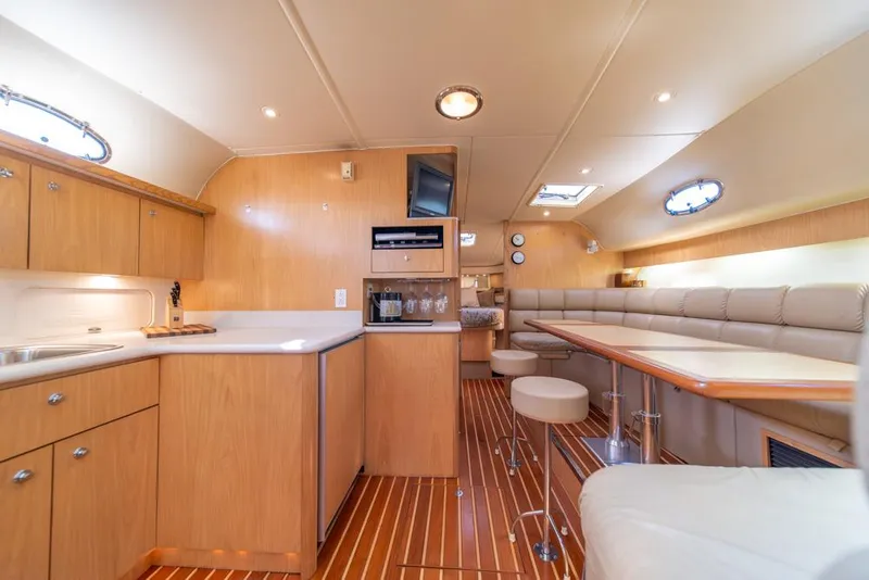 Slide: The Image of Luxurious interior of 2001 Tiara Sport 4000 EXPRESS yacht with modern kitchen and seating area. - 15