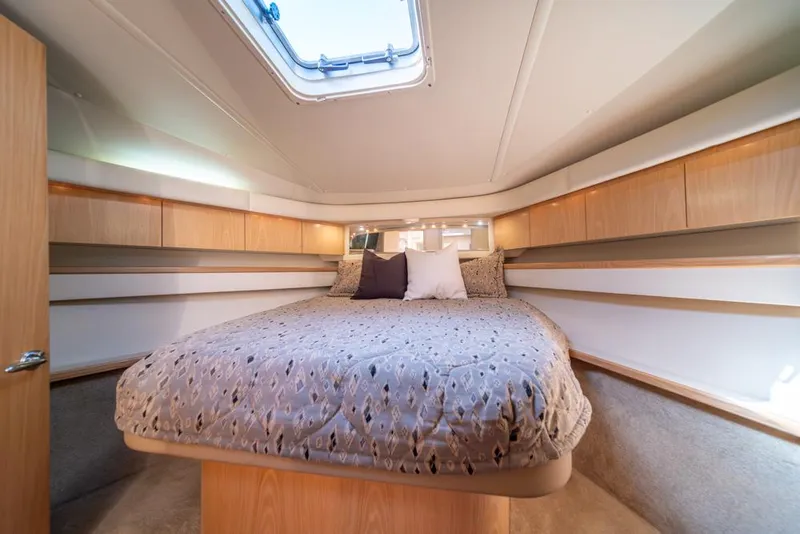 Slide: The Image of Luxurious cabin interior of 2001 Tiara Sport 4000 EXPRESS yacht with cozy bedding. - 16