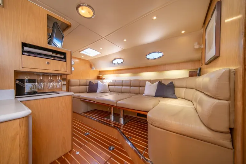 Slide: The Image of Luxurious interior of 2001 Tiara Sport 4000 EXPRESS yacht with plush seating and elegant wood finishes. - 24