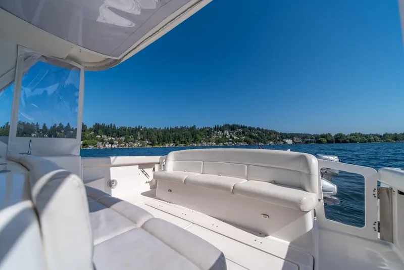 Slide: The Image of 2001 Tiara Sport 4000 EXPRESS yacht interior with lake view and clear blue sky. - 25