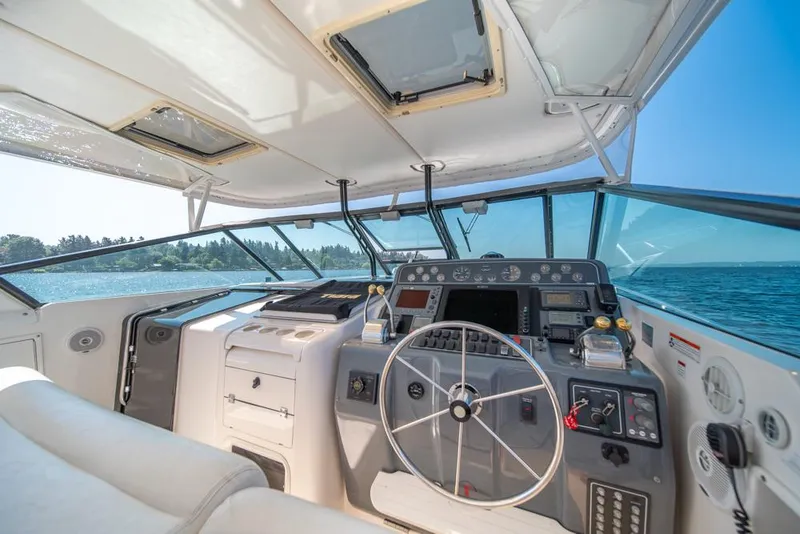 Slide: The Image of Interior view of 2001 Tiara Sport 4000 EXPRESS yacht cockpit with steering wheel and controls. - 34