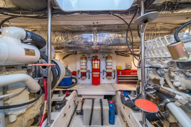Slide: The Image of Engine room of 2001 Tiara Sport 4000 EXPRESS yacht, featuring machinery and safety equipment. - 43