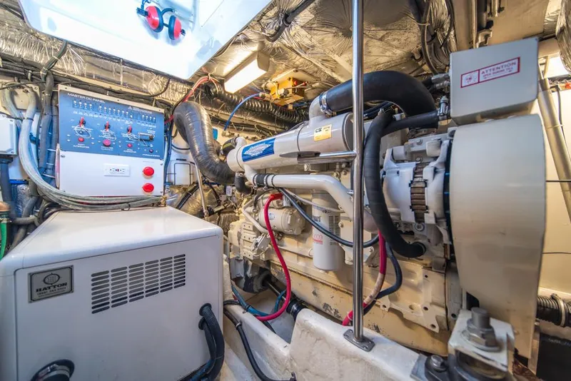 Slide: The Image of Engine room of a 2001 Tiara Sport 4000 EXPRESS, showcasing machinery and control panels. - 45