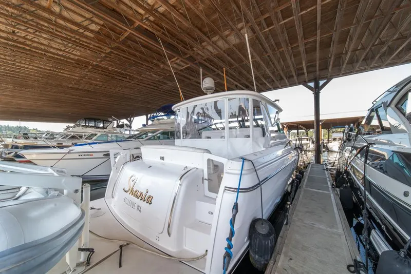 Slide: The Image of 2001 Tiara Sport 4000 EXPRESS yacht docked in a covered marina. - 47