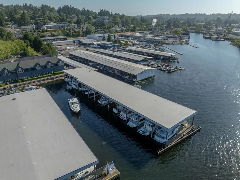 Slide: The Image of Aerial view of marina with covered docks, featuring a 2001 Tiara Sport 4000 EXPRESS boat. - 8