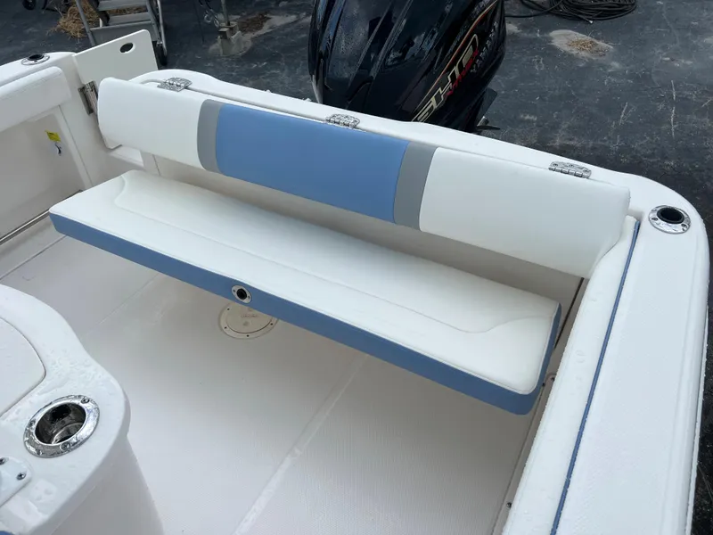 Slide: The Image of 2023 Robalo R222 Center Console boat with blue and white seating. - 12