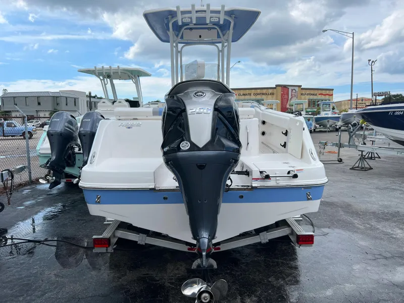Slide: The Image of 2023 Robalo R222 Center Console boat with outboard motor, displayed outdoors. - 3