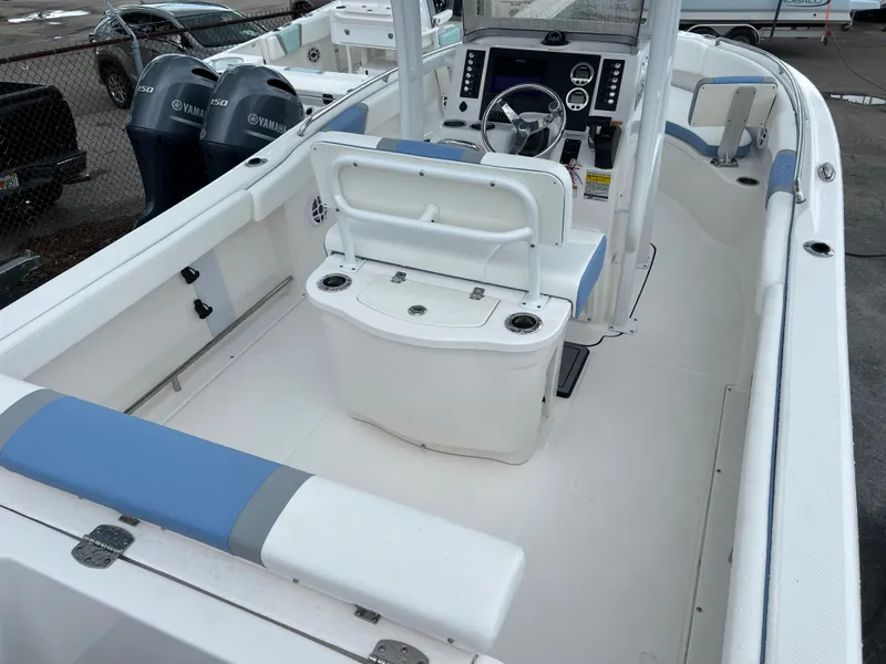 Slide: The Image of 2023 Robalo R222 Center Console boat interior with seating and control panel. - 4