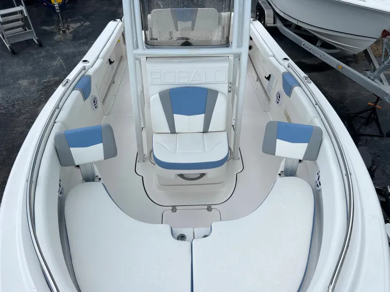 Slide: The Image of 2023 Robalo R222 Center Console boat interior with blue and white seating. - 9