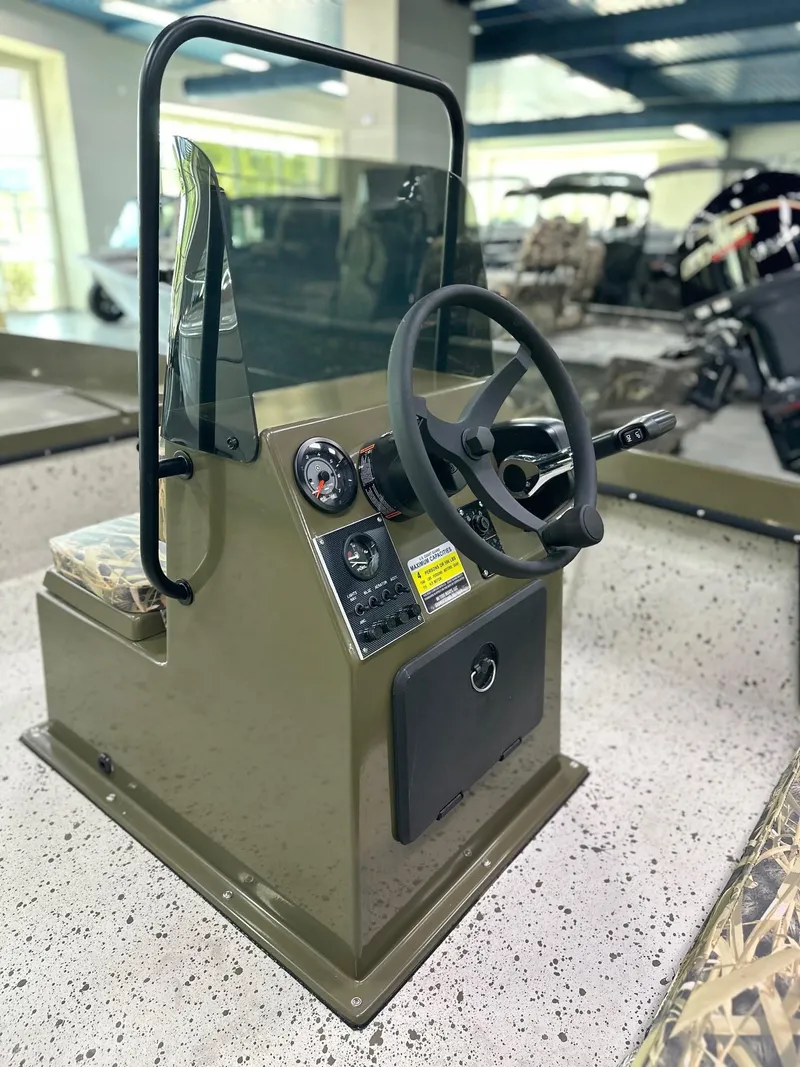 Slide: The Image of 2026 Mi Tide 1602 CC boat console with steering wheel and controls in showroom. - 4