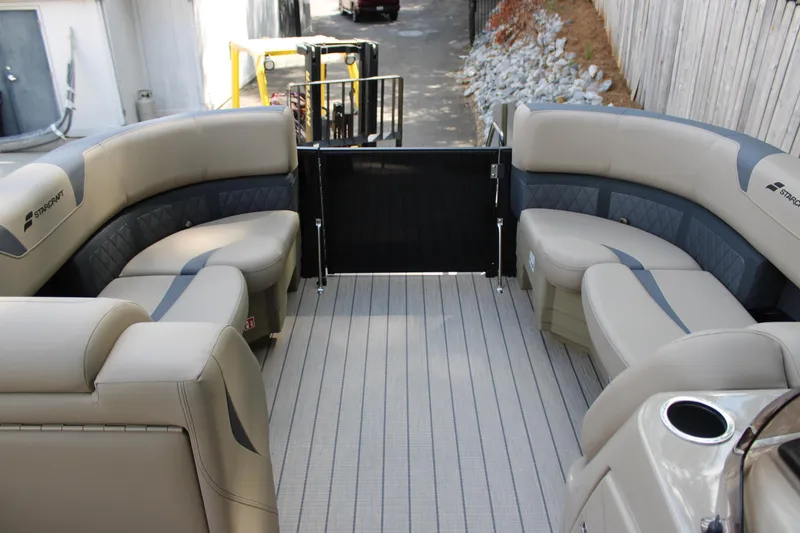 Slide: The Image of Interior of 2026 Starcraft CX 23 RL pontoon boat with beige seating. - 12