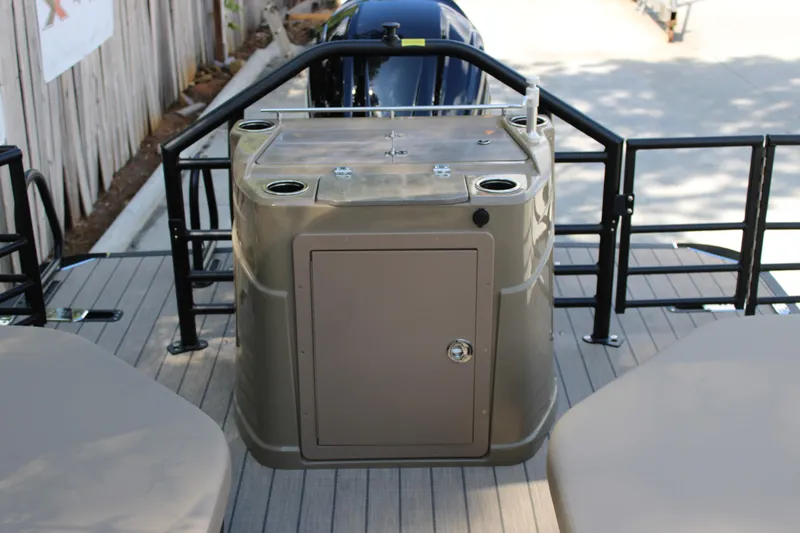 Slide: The Image of 2026 Starcraft CX 23 RL boat deck with storage compartment and railing. - 7