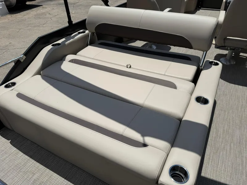 Slide: The Image of 2026 Bentley Pontoons Legacy 243 Swingback with luxurious seating and cup holders. - 13