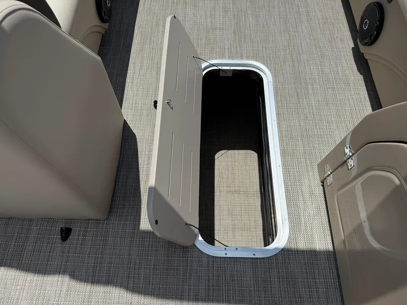 Slide: The Image of Open storage compartment on 2026 Bentley Pontoons Legacy 243 Swingback boat deck. - 8