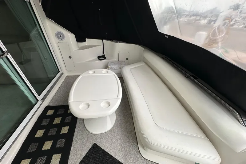 Slide: The Image of Interior of a 2002 Sea Ray 400 Sedan Bridge with seating and table. - 11