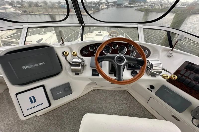 Slide: The Image of Cockpit of 2002 Sea Ray 400 Sedan Bridge with Raymarine navigation system. - 13