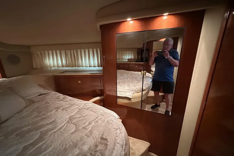 Slide: The Image of Luxurious bedroom interior of 2002 Sea Ray 400 Sedan Bridge yacht. - 33