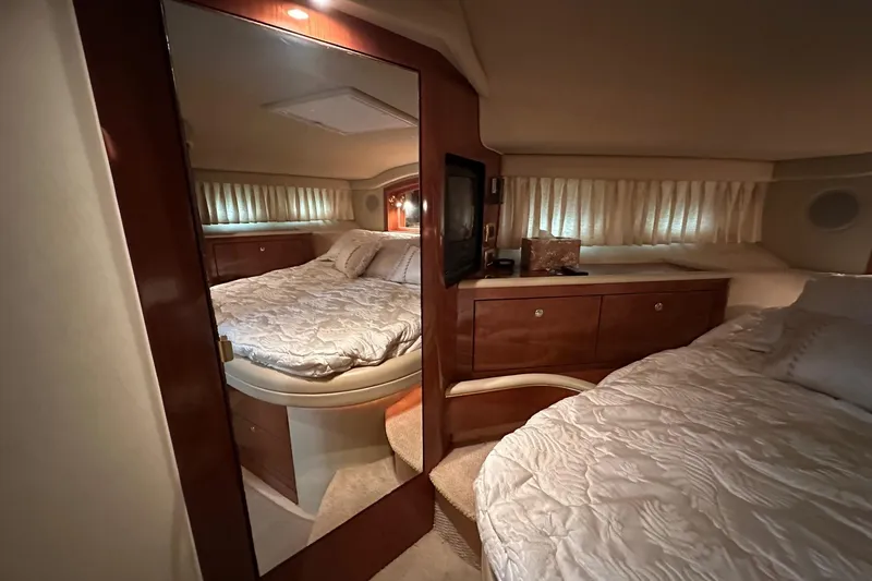 Slide: The Image of Luxurious bedroom interior of 2002 Sea Ray 400 Sedan Bridge yacht. - 34