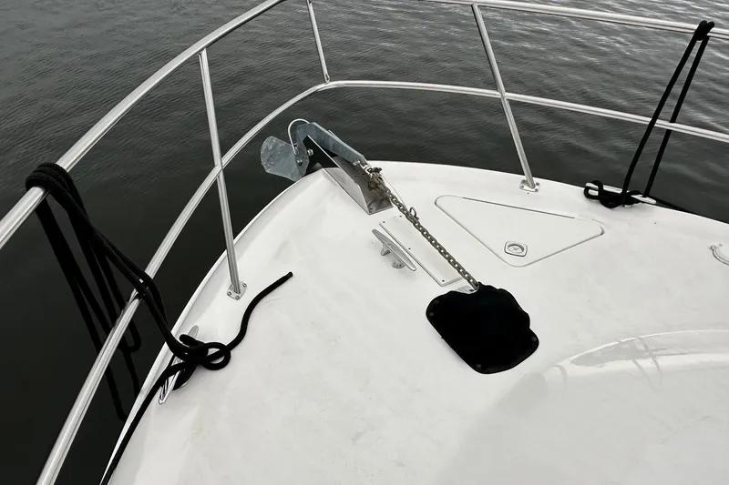 Slide: The Image of Bow of 2002 Sea Ray 400 Sedan Bridge with anchor and railing. - 39