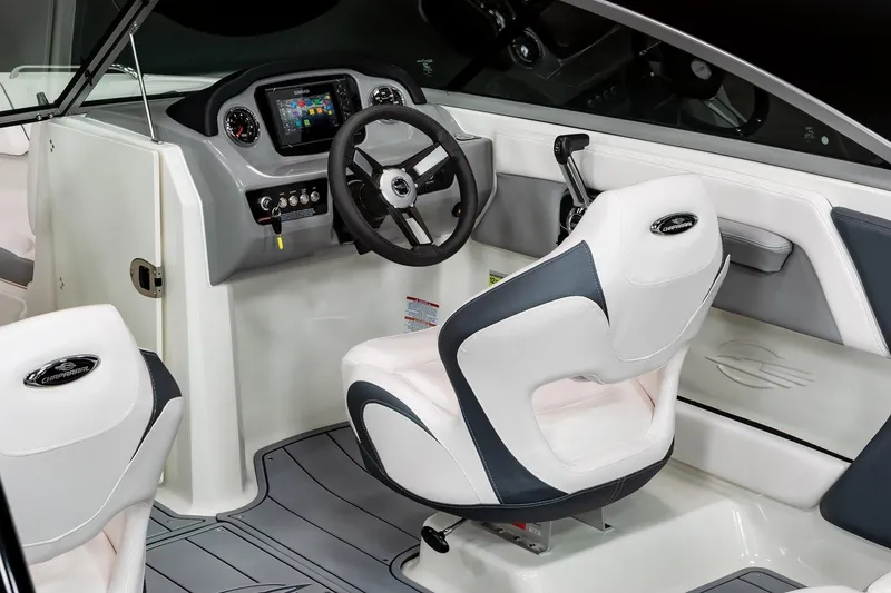 Slide: The Image of Manufacturer Provided Image: 2022 Chaparral 21 Surf boat interior with steering wheel and captain's chair. - 8