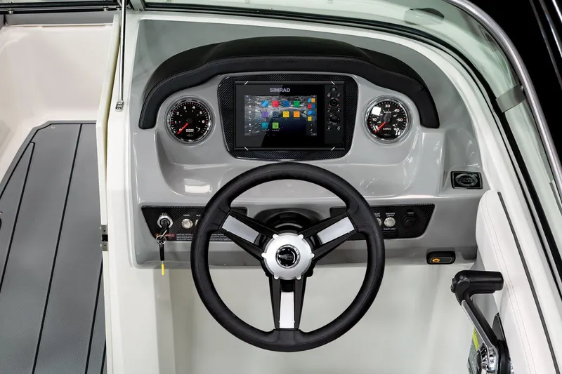 Slide: The Image of Manufacturer Provided Image: 2022 Chaparral 21 Surf boat dashboard with steering wheel and digital display. - 9
