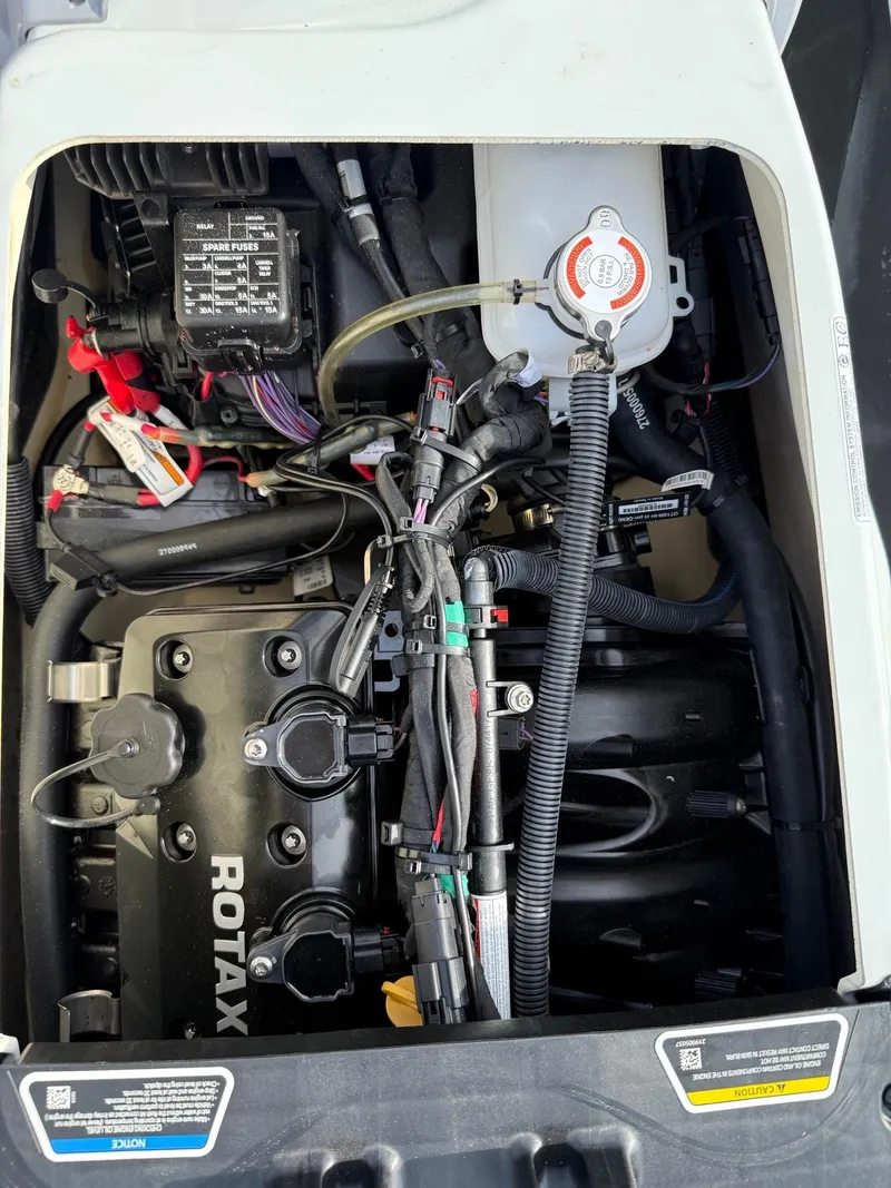 Slide: The Image of 2024 Sea-Doo Fishpro Trophy 170 engine compartment with Rotax components and wiring. - 16