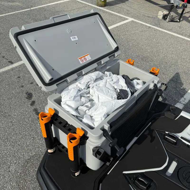 Slide: The Image of 2024 Sea-Doo Fishpro Trophy 170 storage compartment with open lid and contents inside. - 8