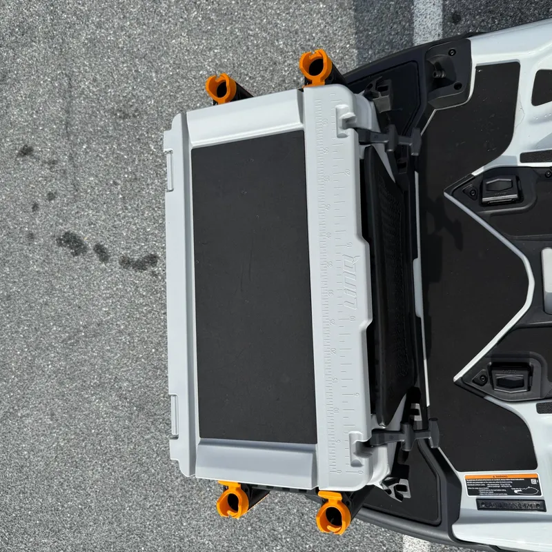 Slide: The Image of 2024 Sea-Doo Fishpro Trophy 170, top view of storage compartment and deck features. - 9