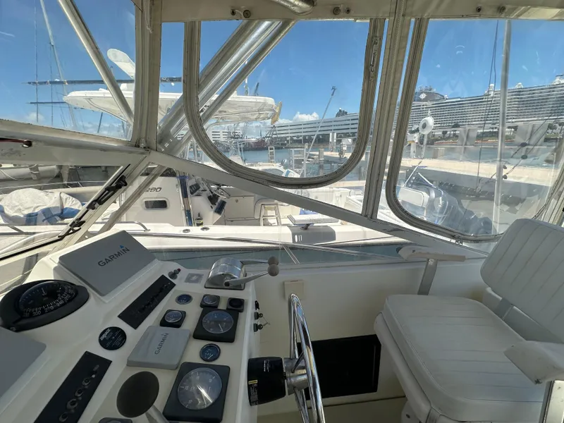 Slide: The Image of Interior view of a 2003 Carolina Classic 28 boat cockpit with navigation instruments. - 17