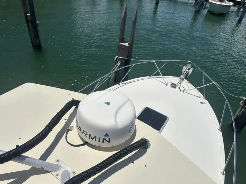Slide: The Image of 2003 Carolina Classic 28 boat with Garmin equipment docked in marina. - 30