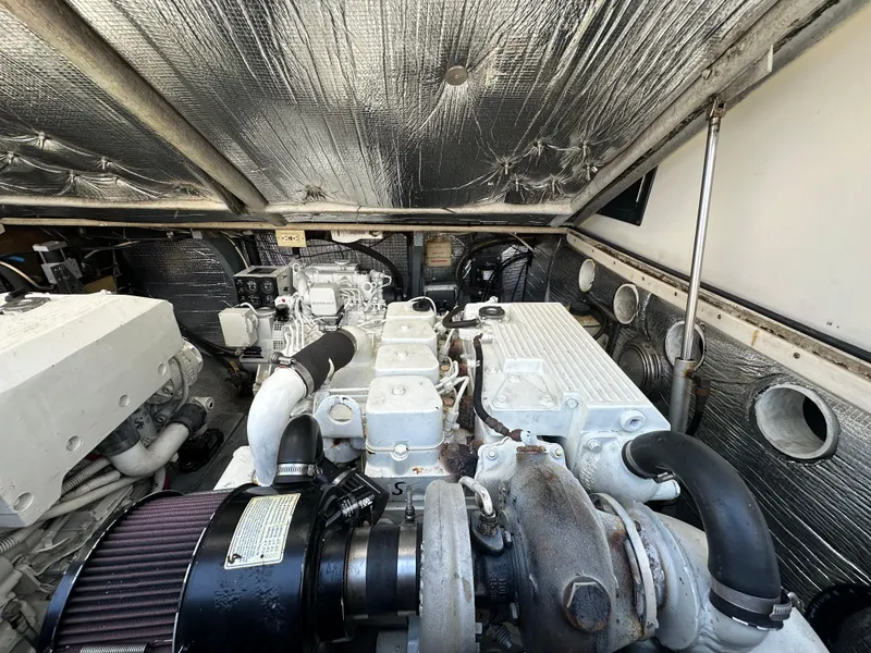 Slide: The Image of Engine compartment of a 2003 Carolina Classic 28 boat, showcasing detailed machinery. - 33