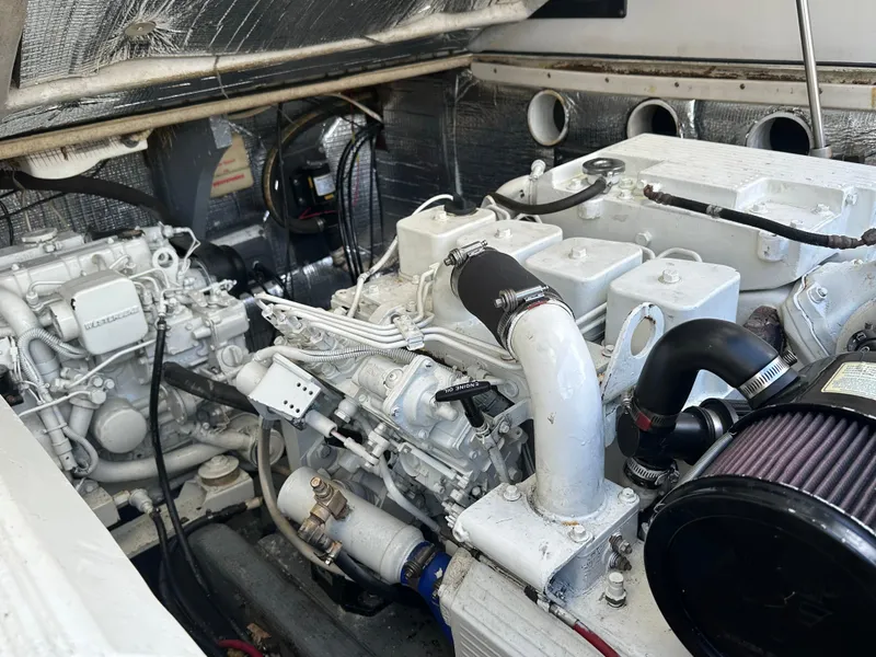 Slide: The Image of Engine compartment of a 2003 Carolina Classic 28 boat, showcasing detailed mechanical components. - 39