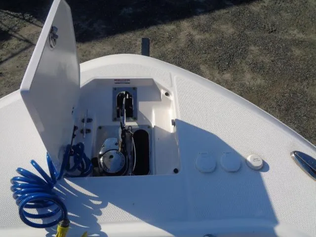 Slide: The Image of 2019 Robalo R272 Center Console boat deck with open storage compartment. - 13