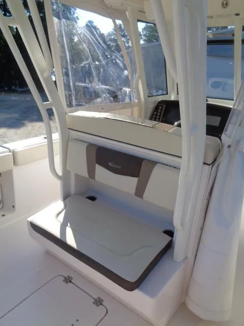 Slide: The Image of 2019 Robalo R272 Center Console boat interior with seating and console. - 22