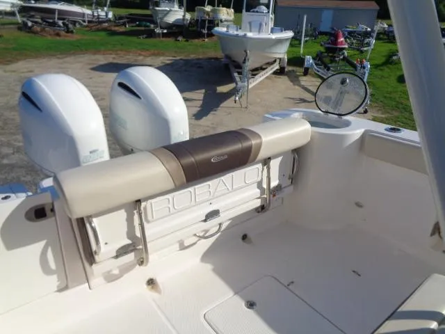 Slide: The Image of 2019 Robalo R272 Center Console boat with dual engines and spacious deck area. - 24