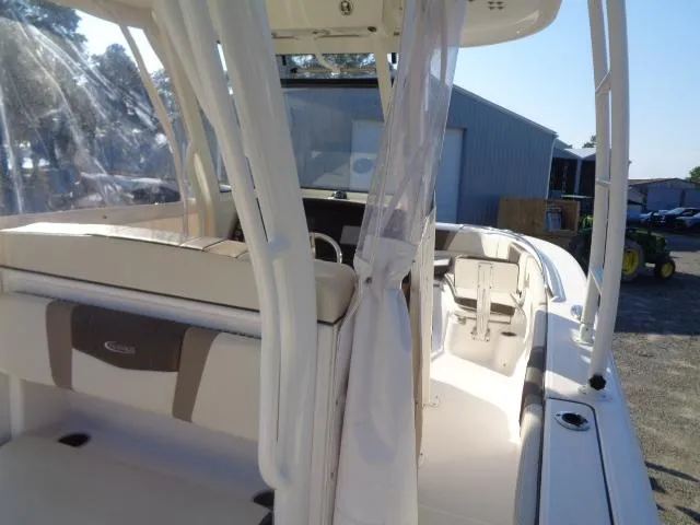 Slide: The Image of 2019 Robalo R272 Center Console boat interior with seating and console view. - 25