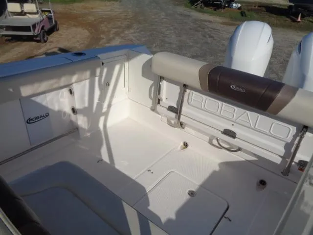 Slide: The Image of 2019 Robalo R272 Center Console boat interior with seating and storage compartments. - 28