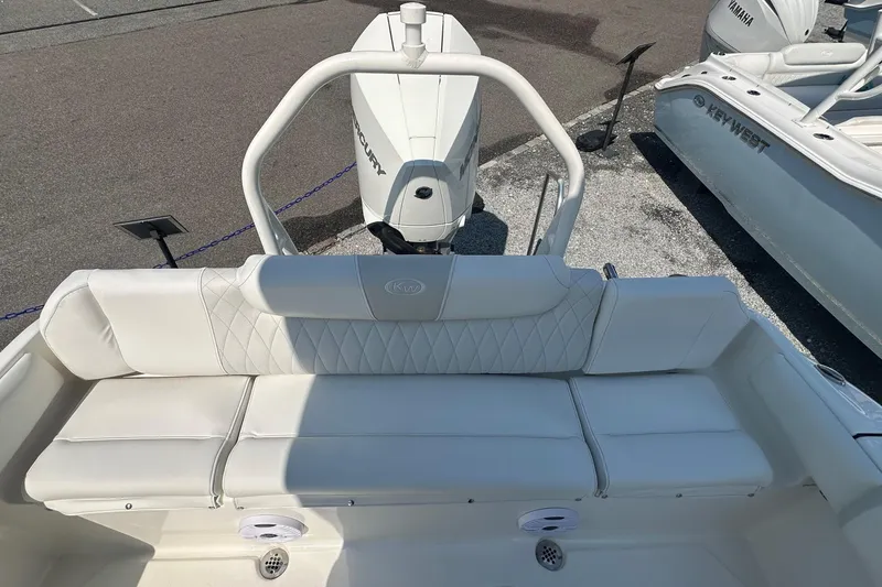 Slide: The Image of 2026 Key West 219 FS boat with white seating and Mercury engine. - 10