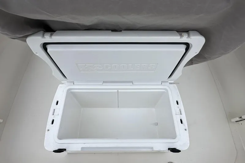 Slide: The Image of Open white cooler inside a 2026 Key West 219 FS boat. - 12