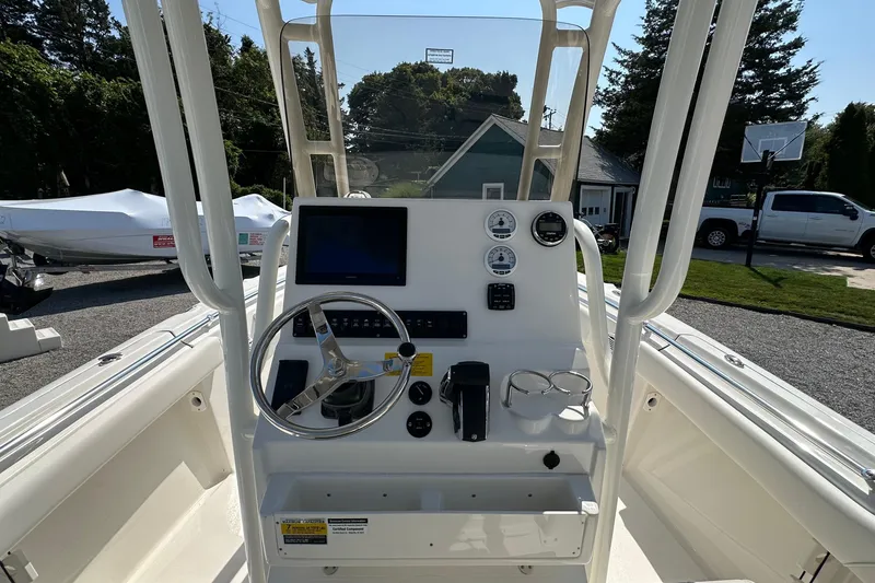 Slide: The Image of 2026 Key West 219 FS boat console with steering wheel and navigation controls. - 15