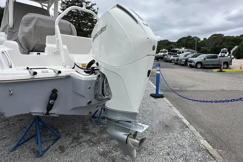 Slide: The Image of 2026 Key West 219 FS boat with Mercury outboard engine in a parking lot. - 4