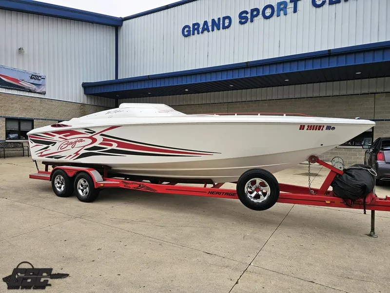 Slide: The Image of 2005 Baja 25 Outlaw boat on red trailer at Grand Sport Center. - 12
