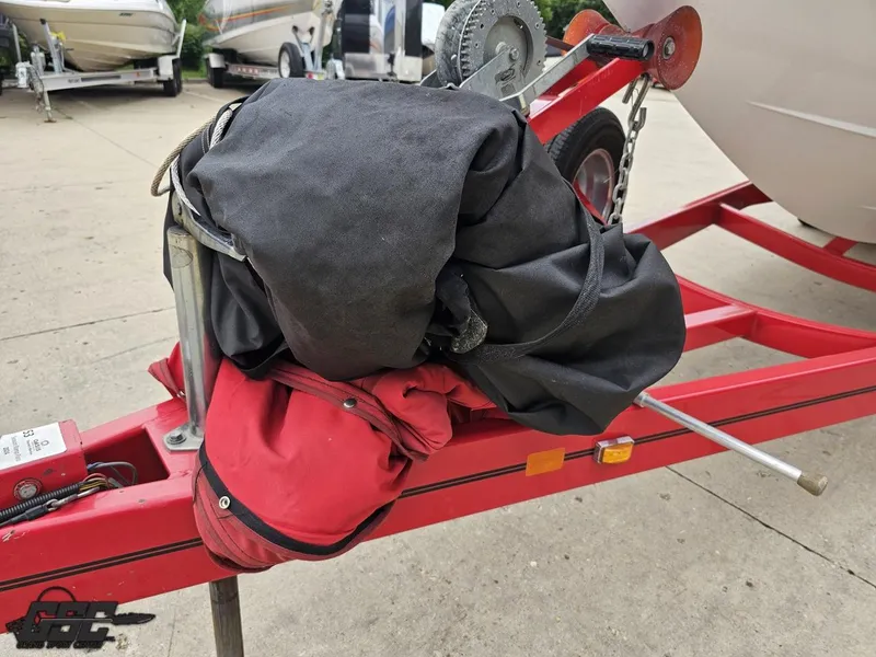 Slide: The Image of Red boat trailer with equipment, 2005 Baja 25 Outlaw in background. - 17