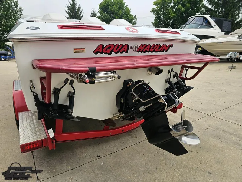 Slide: The Image of 2005 Baja 25 Outlaw boat rear view with dual propellers and custom graphics. - 34