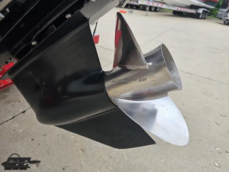Slide: The Image of Close-up of a 2005 Baja 25 Outlaw boat propeller on a concrete surface. - 39