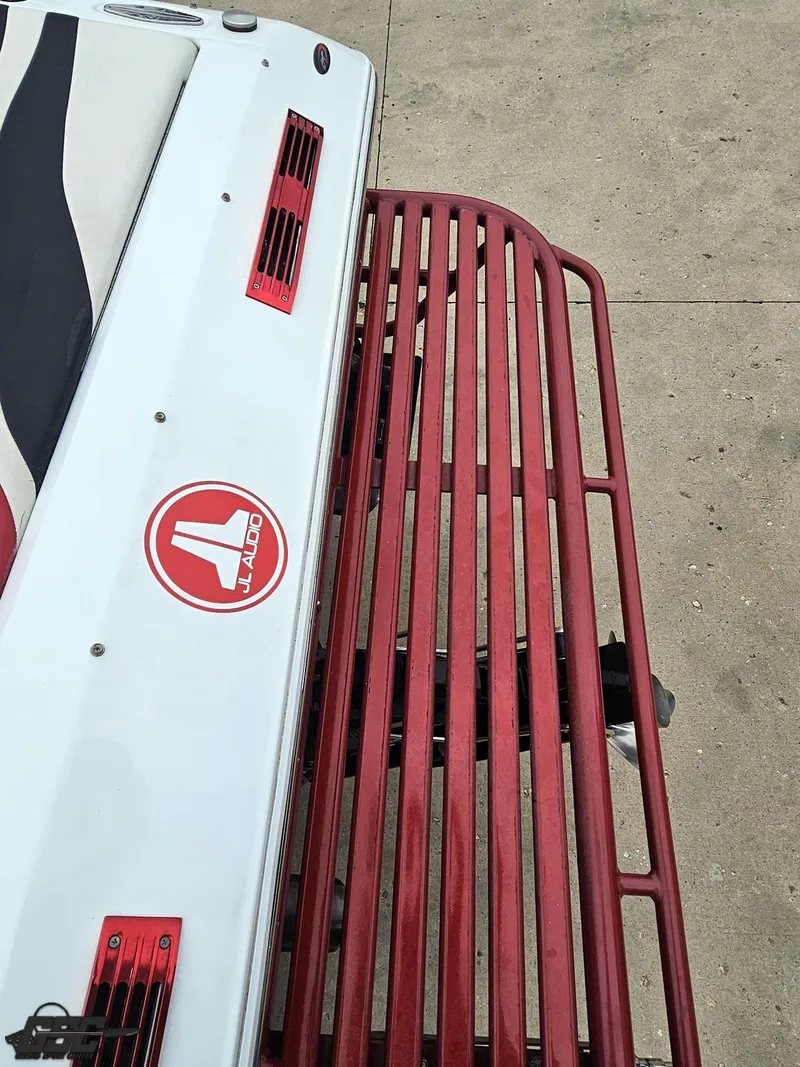 Slide: The Image of 2005 Baja 25 Outlaw boat with JL Audio logo and red accents. - 40