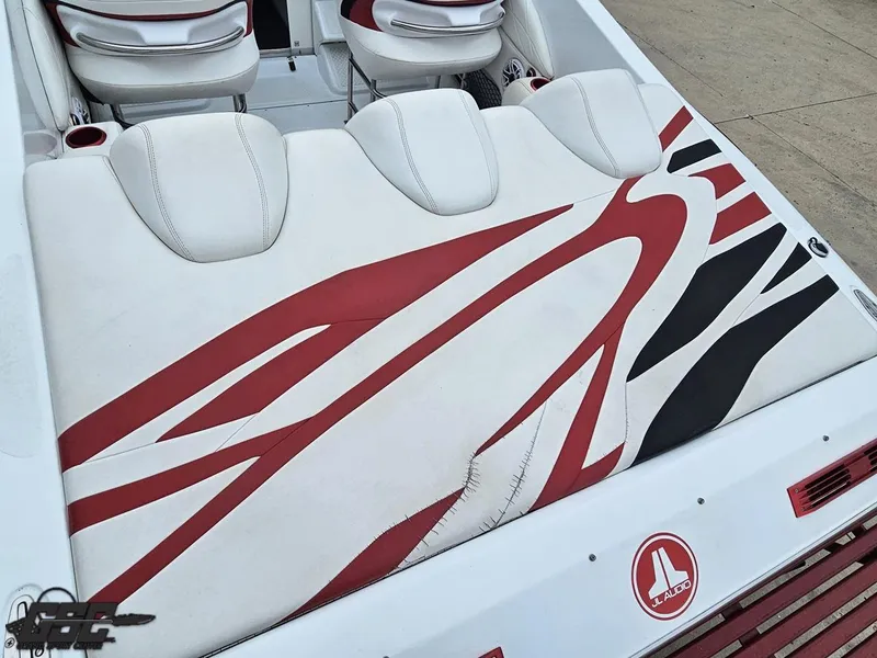 Slide: The Image of 2005 Baja 25 Outlaw boat interior with red and white seating design. - 41